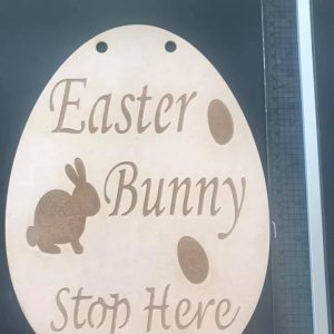 Easter Bunny please stop  hanging sign
